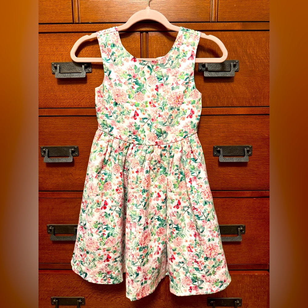 Beautiful girls size 7/8 floral and butterflies dress with bow on back. NWOT